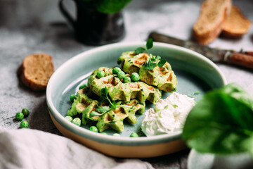 Zucchini waffles with cream cheese. Vegetarian green waffles