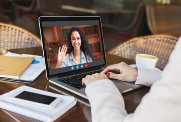 Online Education. Unrecognizable woman having lesson with female tutor via video call