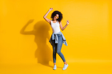 Fototapeta na wymiar Full size photo of afro american girl wear jacket on waist dance isolated on vibrant yellow color background