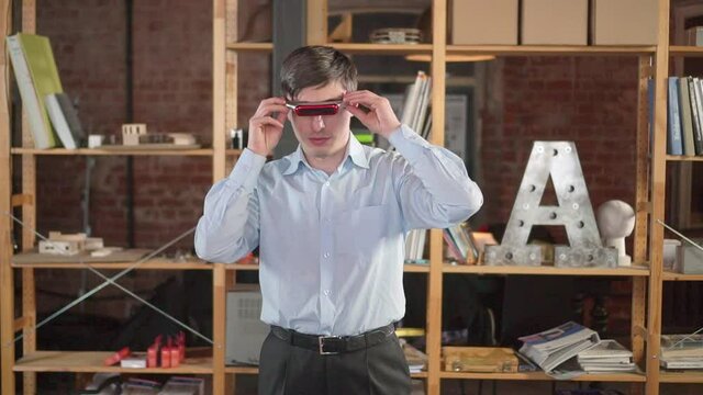 A guy European wears virtual reality glasses