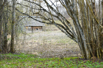 Old bath house made of wooden beams in the village