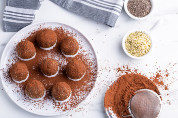 Healthy homemade power balls dessert made with oatmeal, dates, peanut butter, and other bacalias.