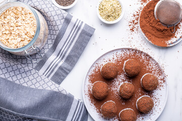 Healthy homemade power balls dessert made with oatmeal, dates, peanut butter, and other bacalias.
