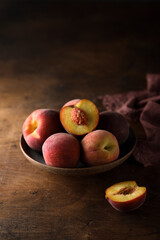 Fresh ripe peaches in a bowl
