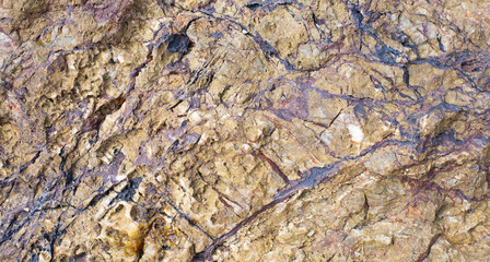 Cracked black-brown natural stone surface