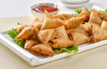 Chicken and Vegetable Samosa, Pakistan and India's most eating snack. Triangle Shape Crunchy Wraps and stuffed with vegetables and chicken.
