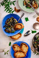 mussels in creamy sauce in a  frying pan.top view