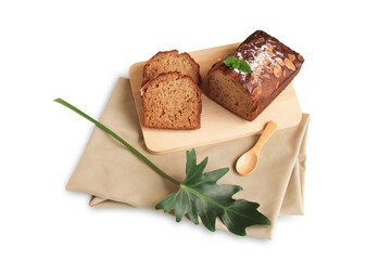 Top view of, Banana cake sliced and loaf on wooden board and spoon, Decorated with Almond slices, Icing sugar, Peppermint, Philodendron Xanadu leaf on light brown cloth isolated on white background.