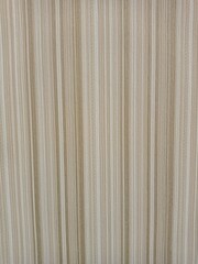Obraz premium Background with vertical stripes of different widths in yellow-green shades. Wallpaper