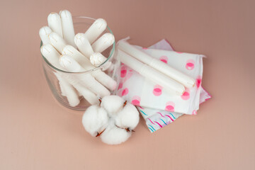 Women pads and tampons on paper background