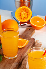 Orange juice cup on table close up