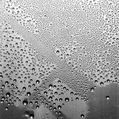 water drops on black plastic texture