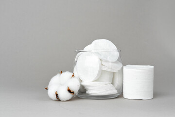 Cotton discs for skincare in a jar on paper background