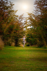 CONTEMPORARY ARTISTIC DANCER DANCING IN THE FOREST IN AUTUMN. CLASSIC DANCE nature
