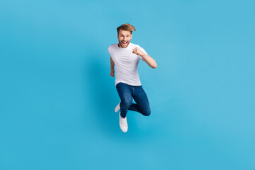 Full body of active carefree person rush toothy smile look camera isolated on blue color background