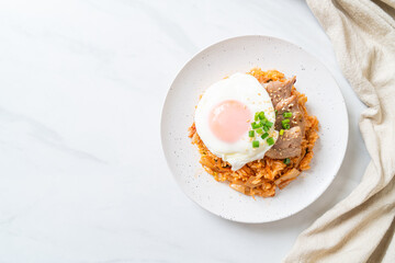 Kimchi fried rice with fried egg and pork