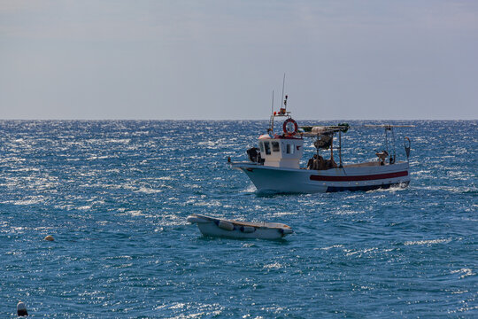 Fishboat comes back to the coast, Almeria, Spain.