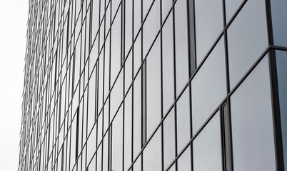 View of a modern glass skyscraper. Glass skyscraper close-up