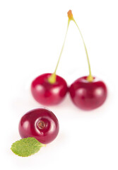 Ripe fresh red cherry isolated on white background.
