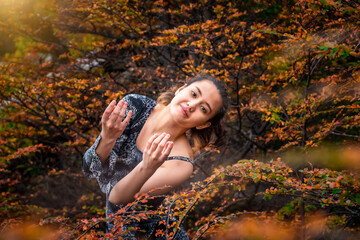 CLASSIC ARTISTIC DANCER IN THE FOREST ON AUTUMN. BEAUTY GIRL IN AUTUMN