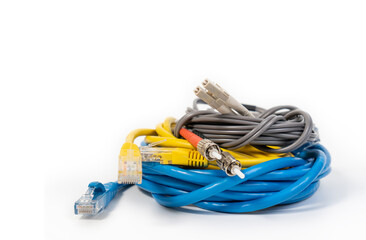 Group of ethernet network cables, rj45 network cable and fiber optic cables isolated on white...