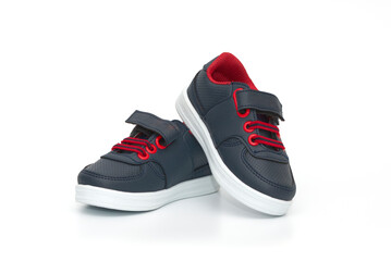 Chidren´s dark blue shoes isolated on the white background.