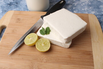 paneer making recipe ingredients, milk and lemon with fresh cottage cheese.