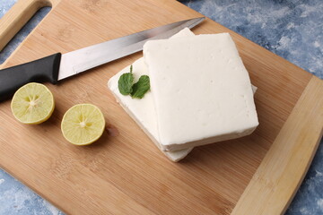 paneer making recipe ingredients, milk and lemon with fresh cottage cheese.