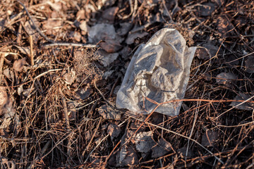 Closeup on small plastic bag in nature