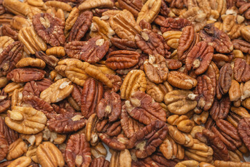 Tasty pecan-nut background. Top view.