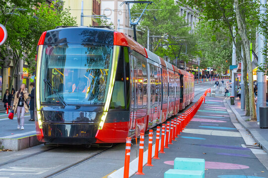 Tram moving through George St in Sydney NSW Australia