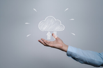 Businessman holding white cloud computing icon from hand drawing on white background , Cloud...