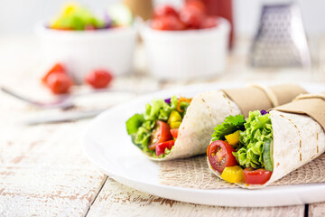 Burritos wraps with mushrooms, pepper and vegetables, spicy Mexican food