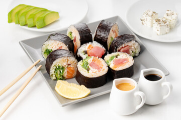Salmon and caviar rolls served on a plate
