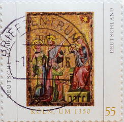 Obraz na płótnie Canvas GERMANY - CIRCA 2005 : a postage stamp from Germany, showing a Cologne painting around 1350 with the three wise men adoring the baby Jesus