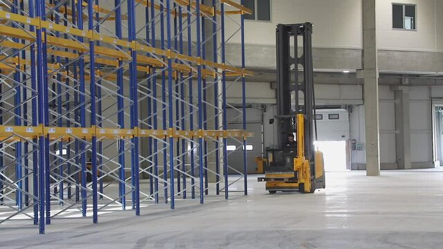 High Rack Stacker Forklift in New Empty Warehouse