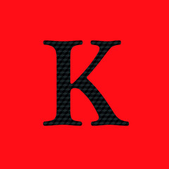 Letter K textured in opaque black metal look editable vector on red background