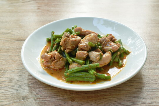 stir fried slice yarg long bean with chicken curry sauce on plate
