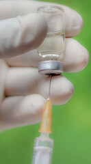 Vaccine vial with hand