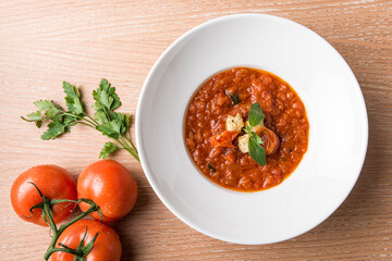 Italian Baked tomato gravy with toasted bread with beef tomato and salad