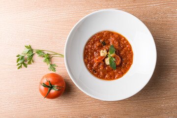 Italian Baked tomato gravy with toasted bread with beef tomato and salad