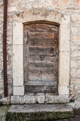 Old wooden italian door in a small village in Abruzzo