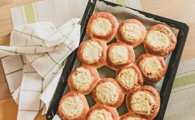 Vatrushka - pastries of ancient Slavic, Russian and Ukrainian cuisines made from butter yeast dough in the form of a small thick cake, in the middle of which there is a filling of cottage cheese.