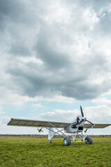 remote controlled agriculture spaying air plane in field at sunset, no people © goami