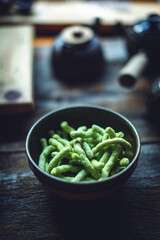 Closeup of green snack food in a bowl.