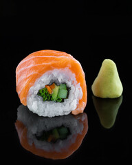 Delicious sushi with red fish on black background.Japan restaurant menu.Japanese food.