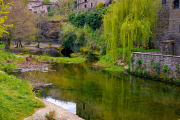 Fototapeta na wymiar Precious corners can be seen bordering the Rupit stream as it passes the medieval nucleus. Rupit, Catalonia, Spain