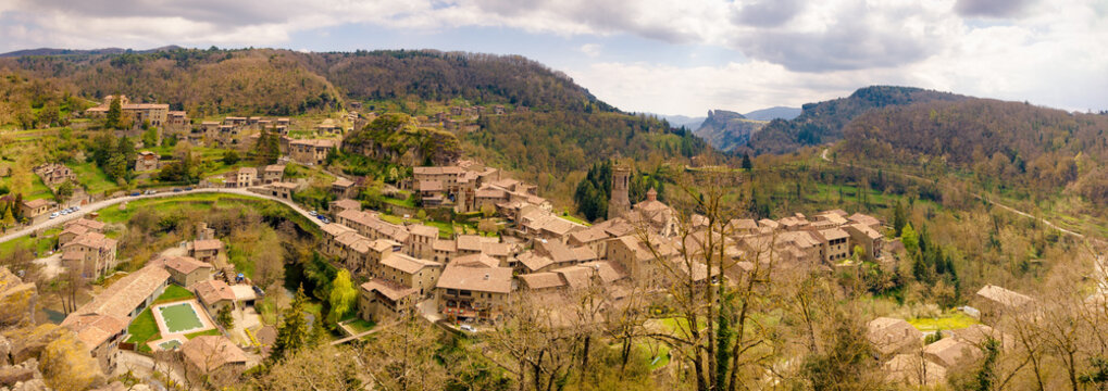 Great aerial panoramic view of the town of Rupit seen from the Soler viewpoint, where you can see the Agullola cliff with the entire town. Rupit, Catalonia, Spain