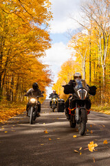Group of friends riding motorcycles in the fall in Canada