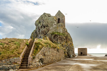 Saint Helier hermitage site with medieval chapel on top with german ww2 bunker in the background,...